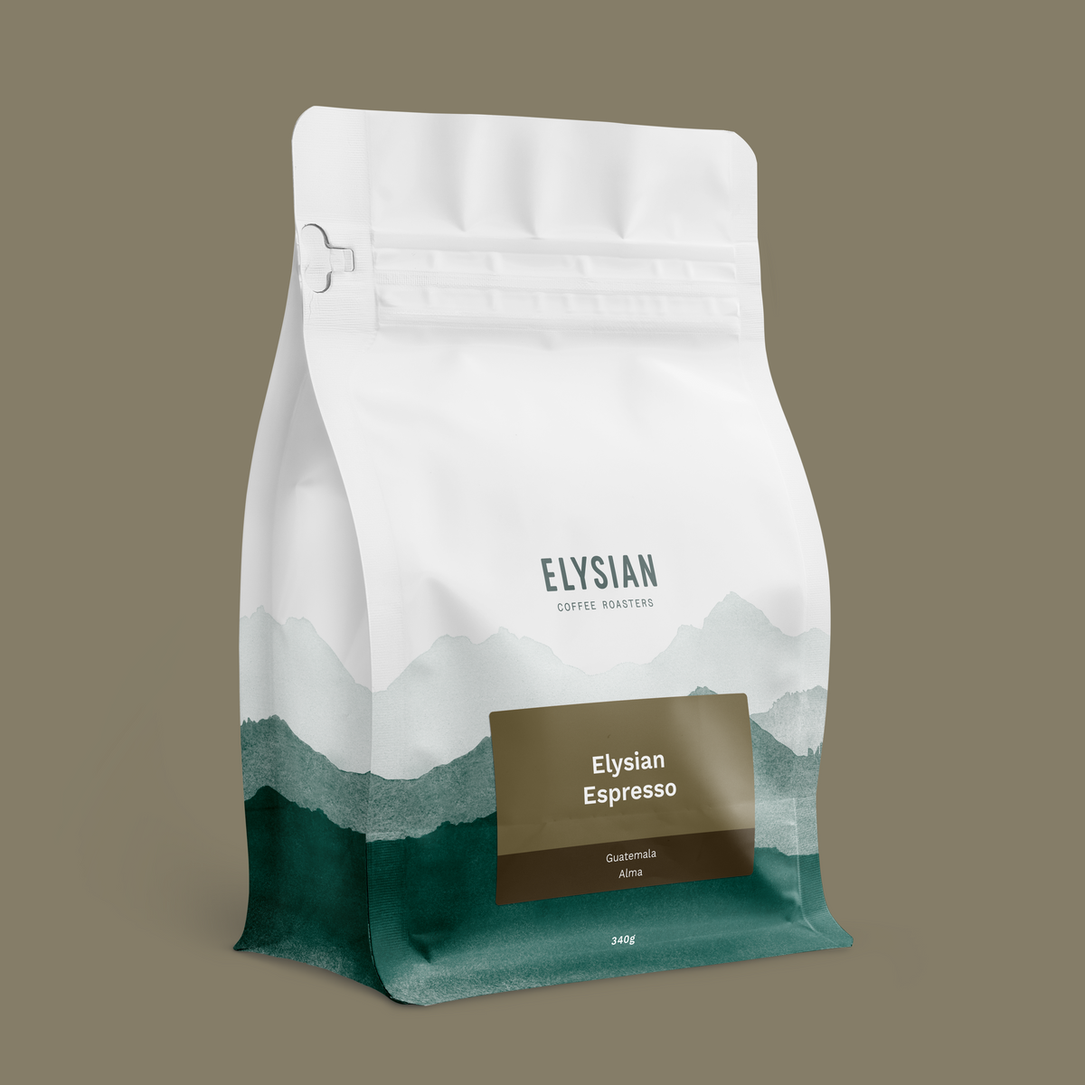 Elysian Espresso coffee bag, white with painted green mountains, on a taupe background